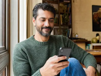 Confident man checking his phone